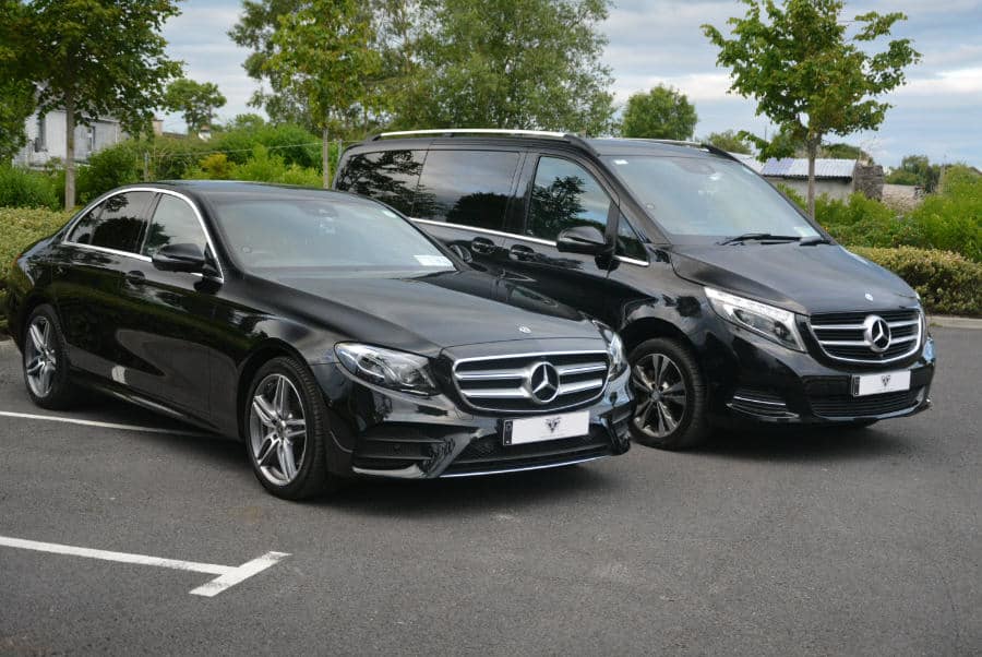 two luxury black mercedes benz eclass and vclass