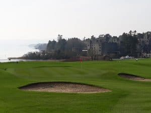 ashford castle golf course in the background of ashford castle and corrib lake other chauffeur driven service provide by airports direct